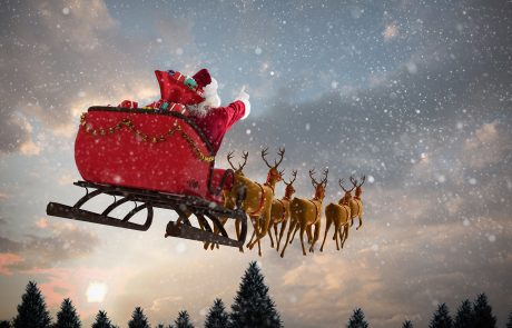 Composite image of santa claus riding on sleigh with gift box